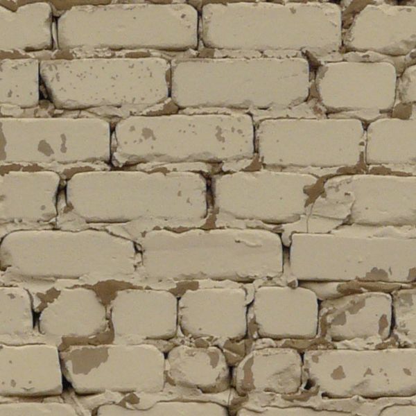 Old brick wall painted white.