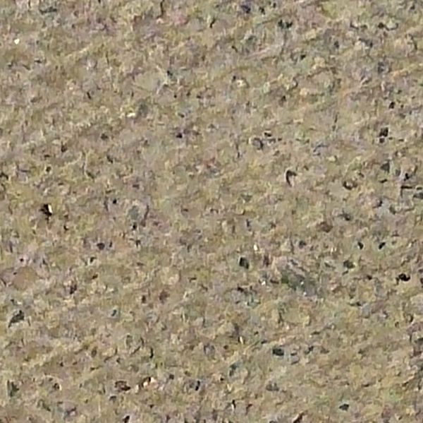 Pavement of square tiles in beige tone with embedded, diamond patterns on surface.