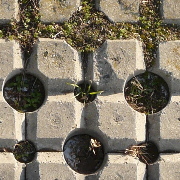 Seamless texture consisting of grey bricks set in repeating pattern with large gaps and holes in between.