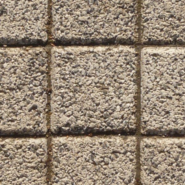 Seamless pavement texture made of small, square cement tiles with rough surface.