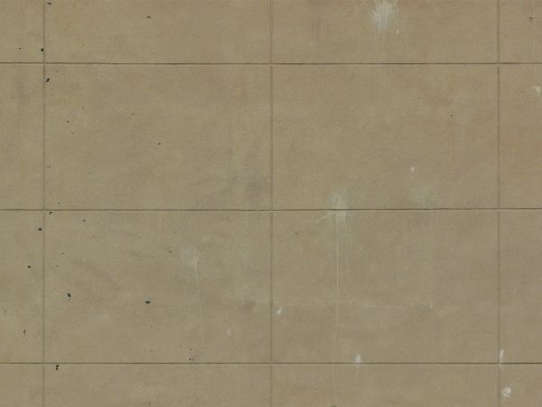 Concrete texture of rectangular blocks in beige color set evenly with slightly dirty surface.