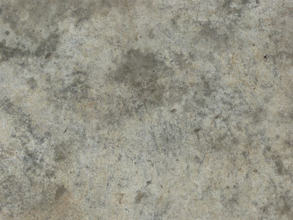 Concrete base in grey tone with various stains on surface.