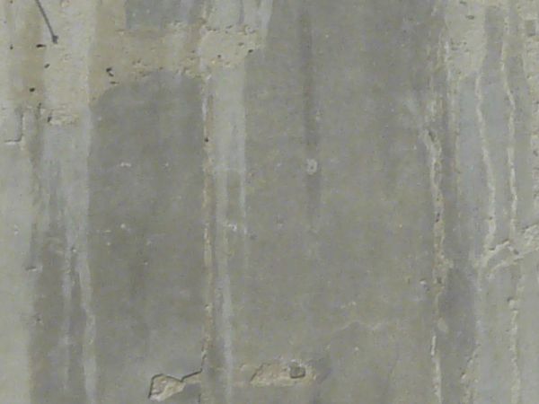 Worn concrete base in light grey tone with light streaks on surface.