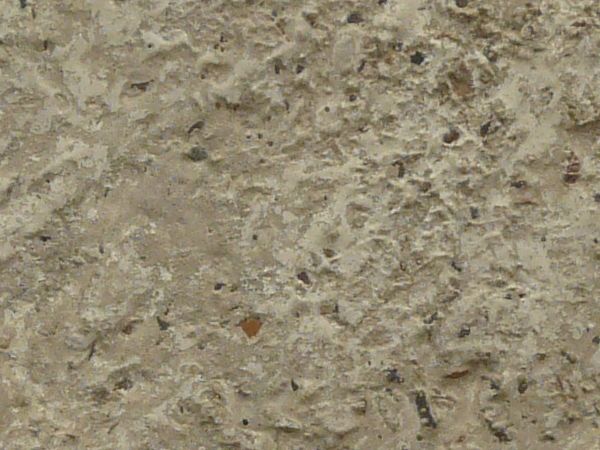 Concrete texture in light brown tone with very rough, irregular surface.