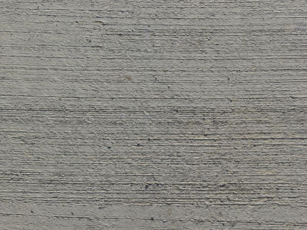 Clean, grey concrete texture with rough consistency and horizontal lines across surface.