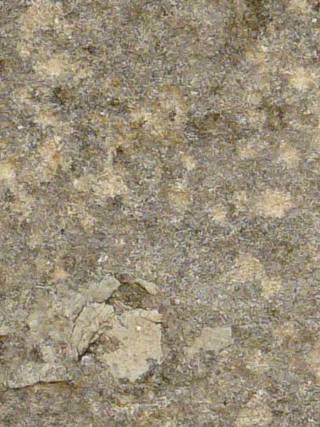 Irregular concrete floor texture in grey and light beige tone with very rough, worn surface.