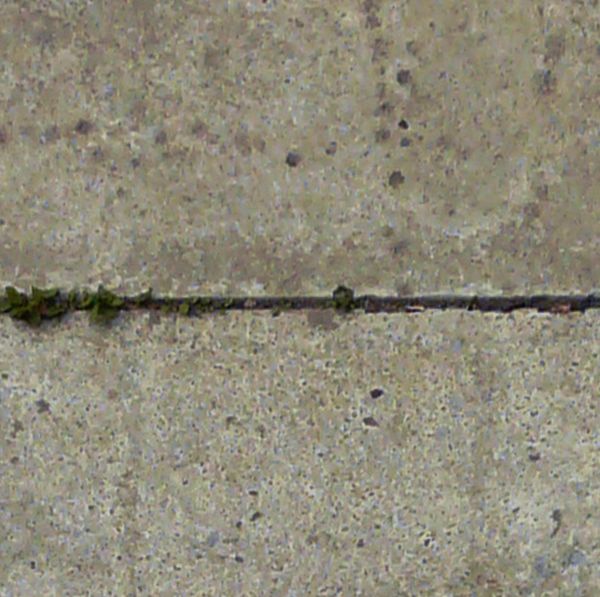 Worn ground texture of concrete slabs in light grey tone with slightly worn surface and holes on edges.