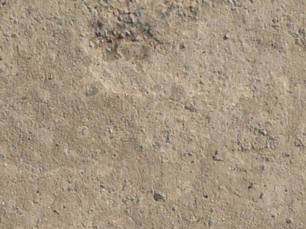 Concrete floor texture in light beige tone with slightly rough, worn consistency.