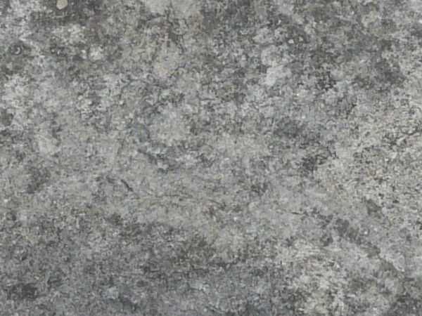 Concrete floor texture in mixed shades of grey with few, small cracks in surface.