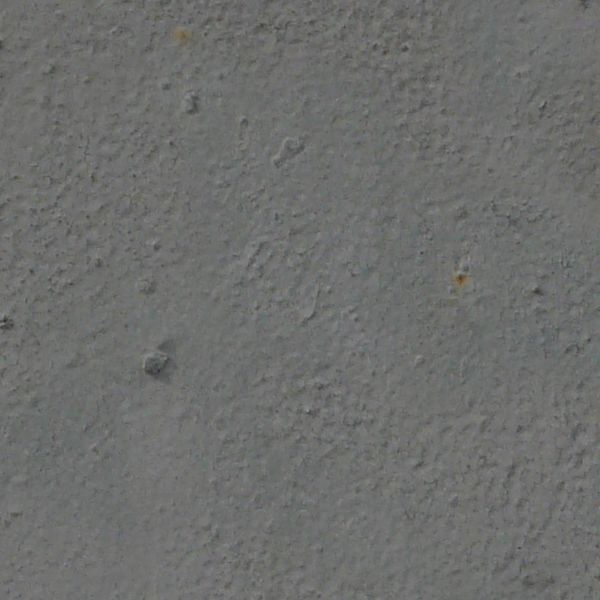 Seamless metal texture in dark grey tone with small bumps and dents.