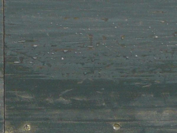 Metal base texture with rust and algae at the bottom.