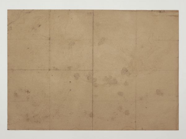 Tan paper texture with dark smudges and a pattern of large, folded rectangles.