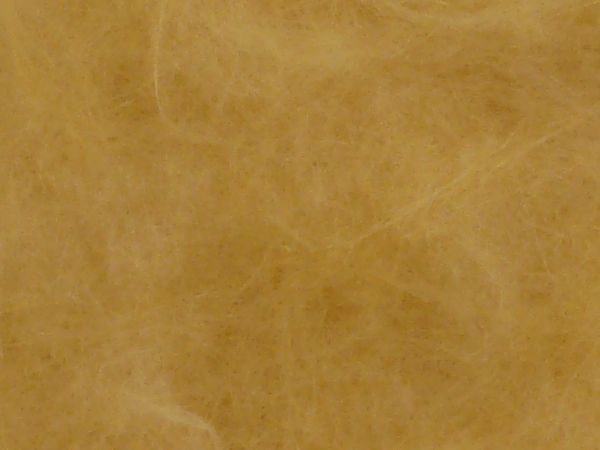 Close-up textures of thin, yellow plastic fibers in random formation.