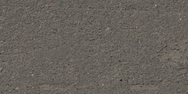Seamless texture of dark grey road with white and yellows lines and worn, bumpy surface.