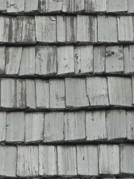 Roofing texture of grey, wooden planks with slightly worn surfaces.