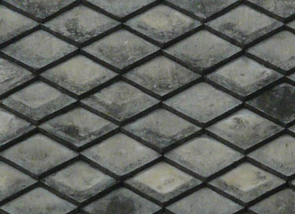 Roof texture consisting of dark grey shingles installed in diamond pattern.