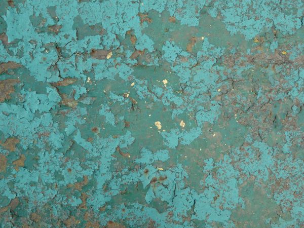 Blue painted metal texture, with extensive chipping, discoloration and faint brown rust stains.