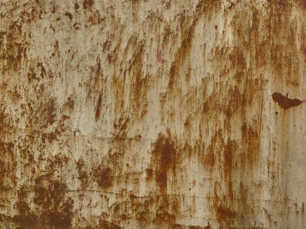 Painted metal texture, covered almost completely by thin brown rust scratches and stains.