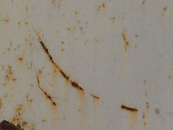 White painted metal texture with several heavy rust scratches and significant brown stains.