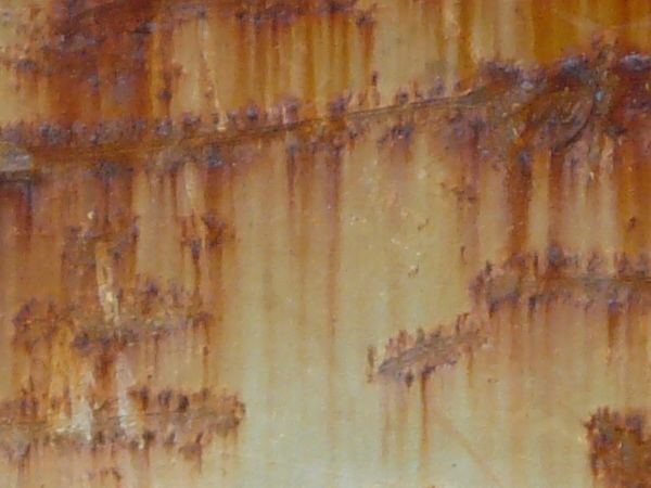 Rusted ledge texture, covered with many heavy horizontal scratches.