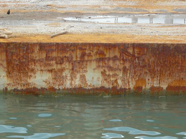 Rusted ledge texture, covered with many heavy horizontal scratches.