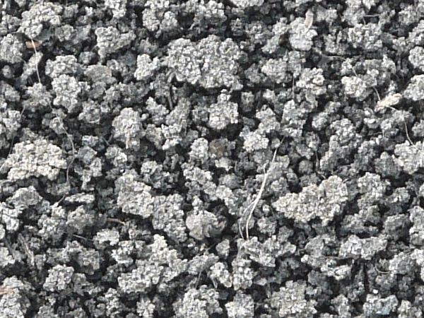 Rough grey ground texture, dried into small seperate irregular clumps.