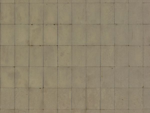 Rectangular tiles in beige tone with rough texture and few chipped edges.