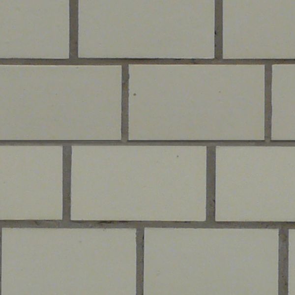 Seamless texture of grey, rectangular tiles set in even formation with clean, consistent surface.