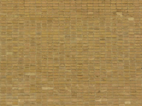 Seamless tile texture in shiny, gold tone set in even formation.