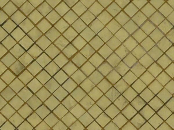 Worn tile texture in pale yellow tone laid in diamond pattern with brown grout.