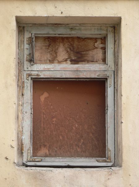 Boarded window texture with stained red and brown wood panels inside Boarded window texture with stained red and brown wood panels inside