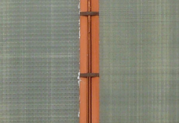 Murky windows texture, with reddish brown trim separating the panes.