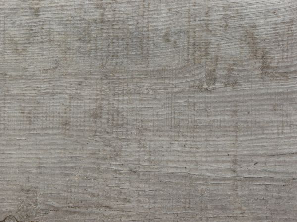 Old grey wood texture, with large cracks and areas of chipping paint.