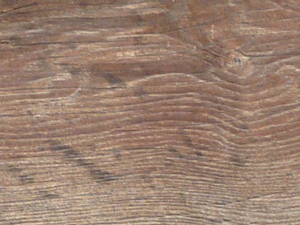 Old brown wood texture, with prominent grain, and many cracks and knots.