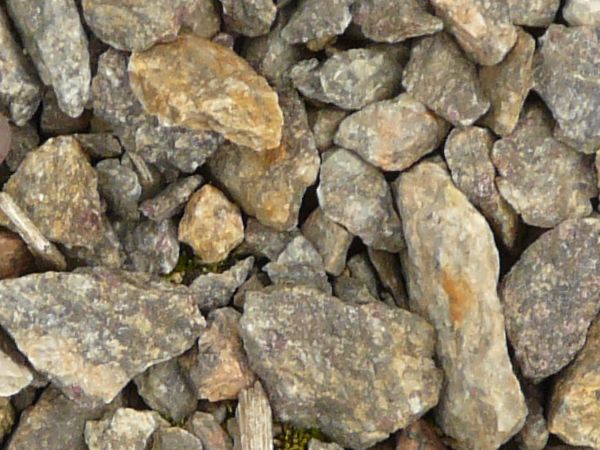 Large pebbles texture, in various sizes and shades of grey and brown.