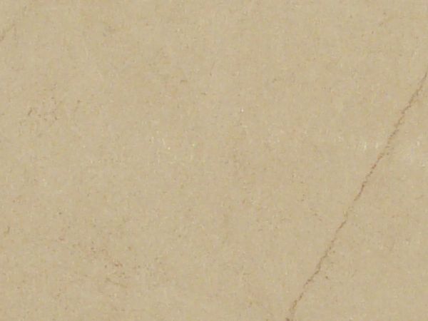 Tan paper texture with faintly visible dark marks and a torn top edge.