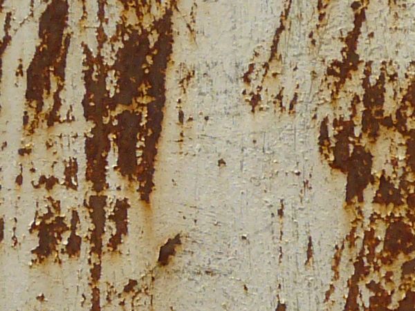 White metal texture with large, irregular patches of red rust and many small rusted scratches.