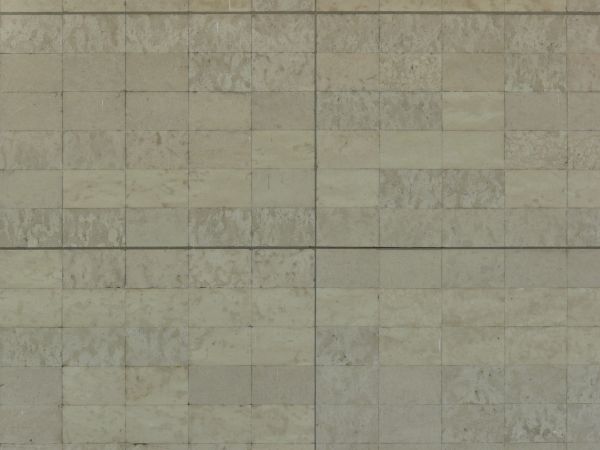 Seamless texture of rectangular tiles in beige tones set horizontally in even formation.