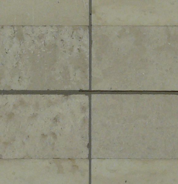 Seamless texture of rectangular tiles in beige tones set horizontally in even formation.