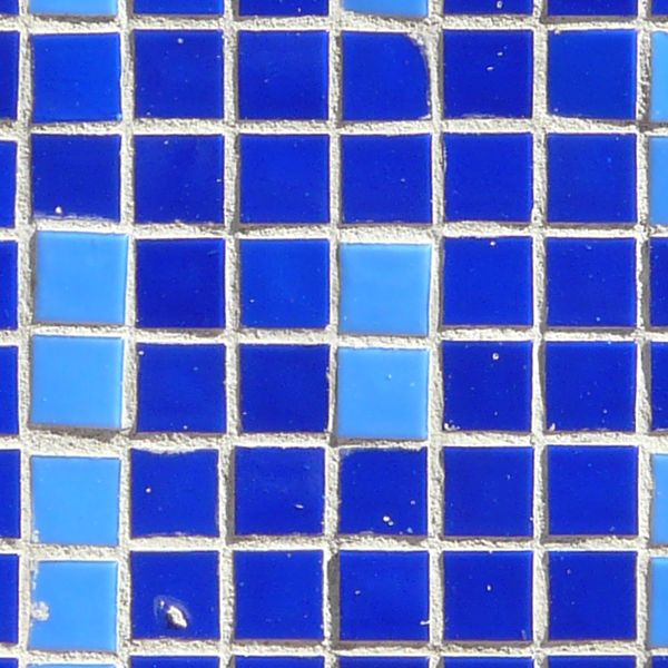 Seamless texture of small, square tiles in blue tones set evenly in white grout.