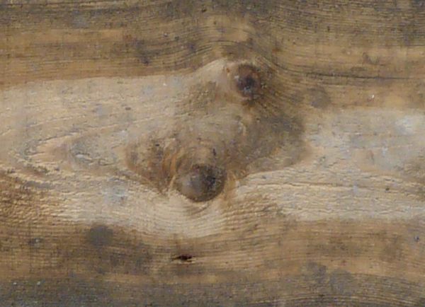 Texture of wooden planks in light beige tone with slightly worn surface.